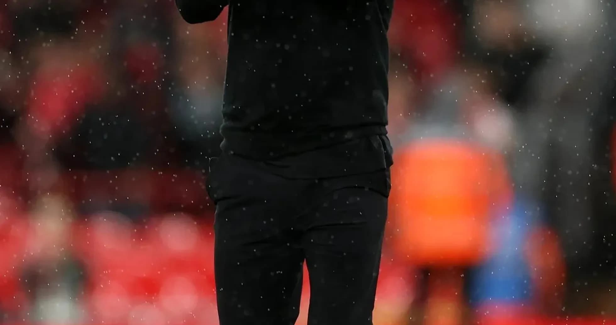 Coach applauding while walking on the pitch Coach applauding while walking on the pitch