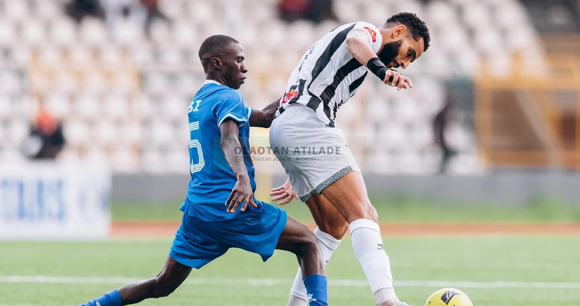CS Sfaxien player challenging Shooting Stars opponent CS Sfaxien player challenging Shooting Stars opponent