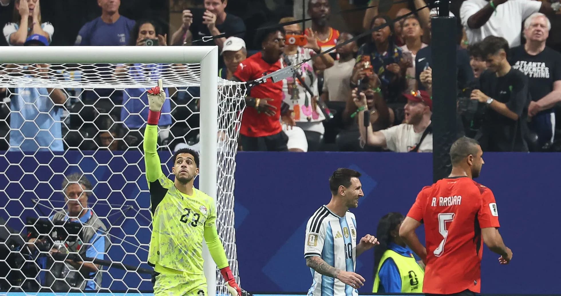 Goalkeeper celebrating with teammates after a save Goalkeeper celebrating with teammates after a save