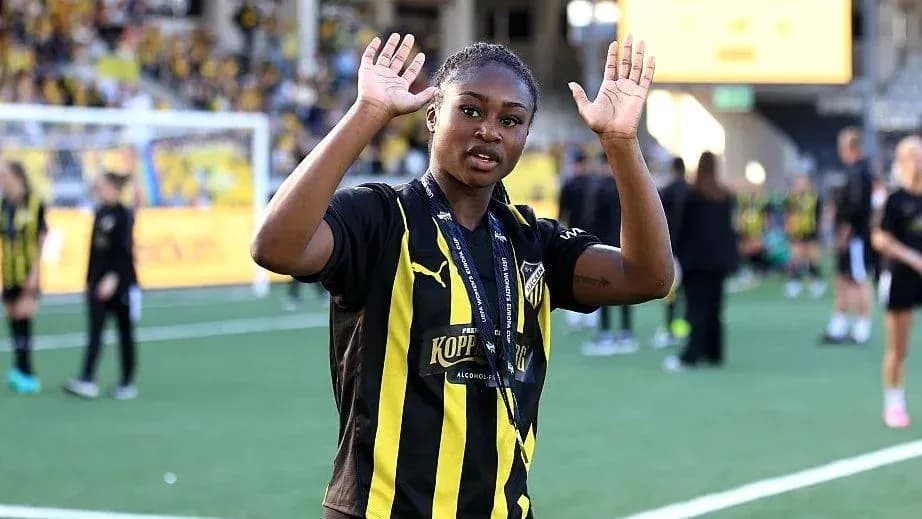 Player waving on the field after a match Player waving on the field after a match