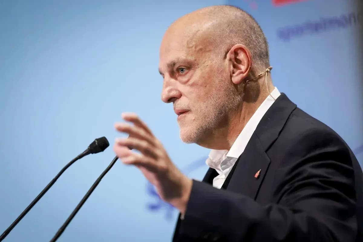 Speaker gesturing during a press conference Speaker gesturing during a press conference