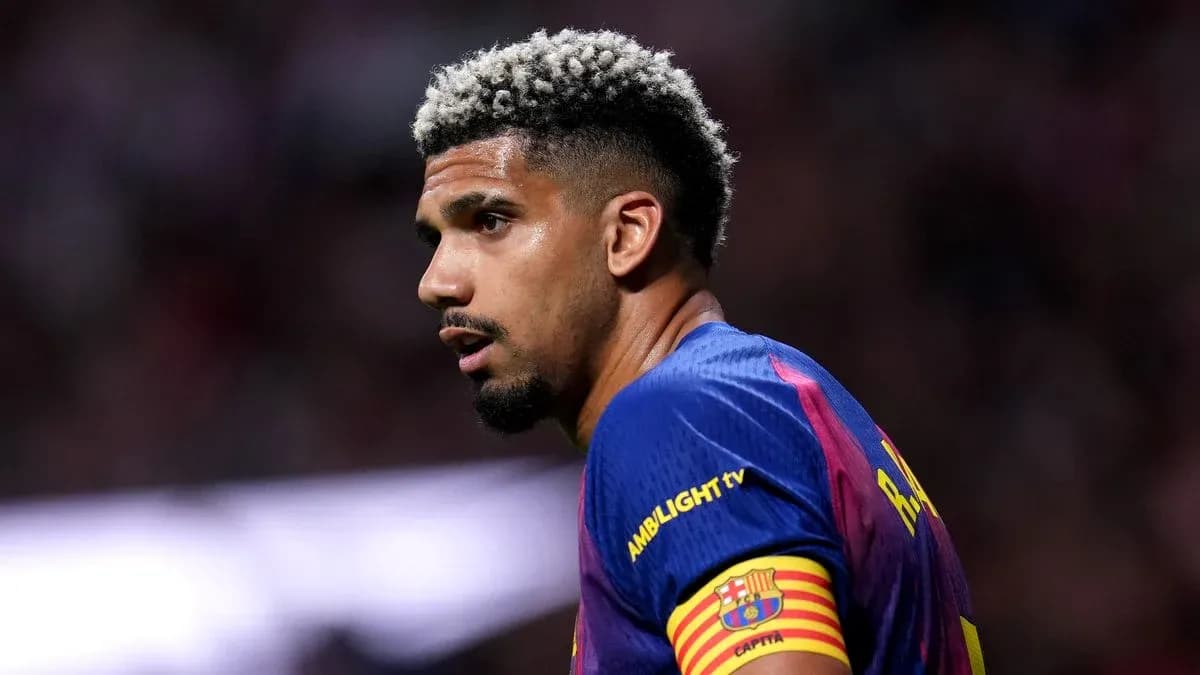 Player with blonde curly hair wearing Barcelona jersey Player with blonde curly hair wearing Barcelona jersey