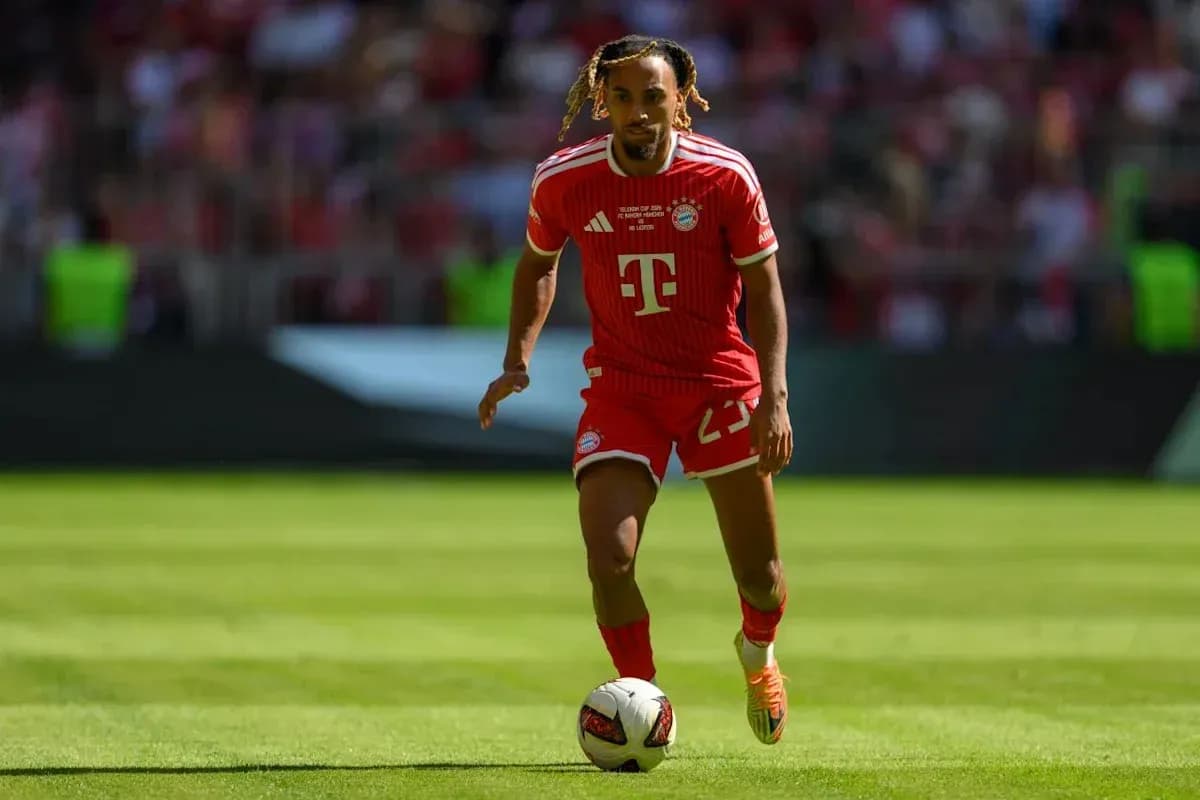 Player in red Bayern Munich kit running with ball Player in red Bayern Munich kit running with ball