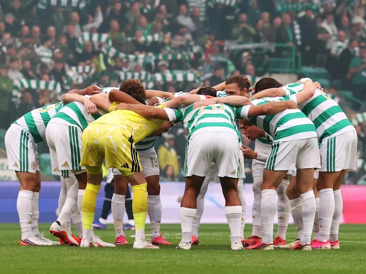 Celtic players huddled together on the pitch Celtic players huddled together on the pitch