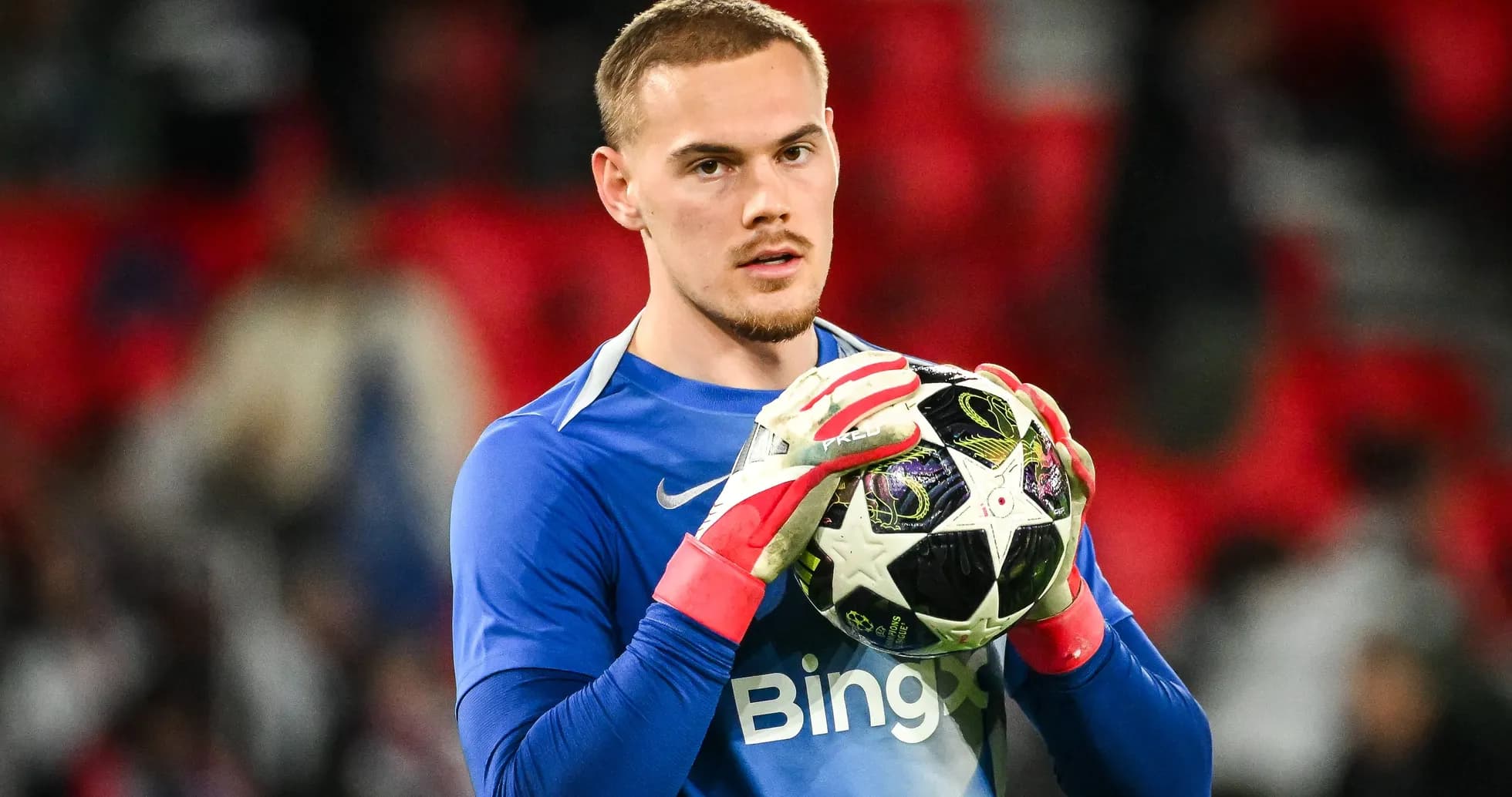 Goalkeeper holding football before match kickoff Goalkeeper holding football before match kickoff