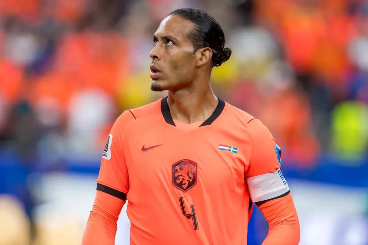 Player in orange kit looking up during match Player in orange kit looking up during match