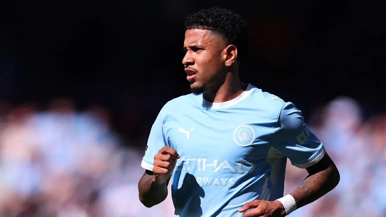 Player in light blue Manchester City kit during match Player in light blue Manchester City kit during match