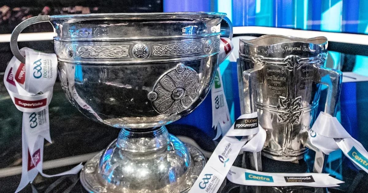 Two silver trophies with GAA ribbons displayed Two silver trophies with GAA ribbons displayed
