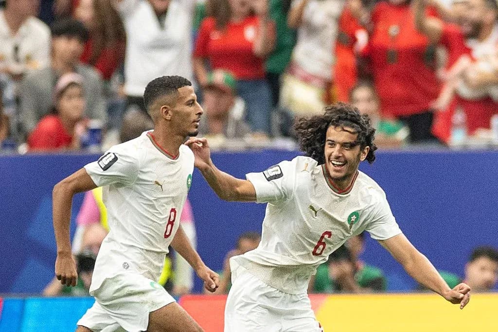 Moroccan players celebrating a goal during match Moroccan players celebrating a goal during match