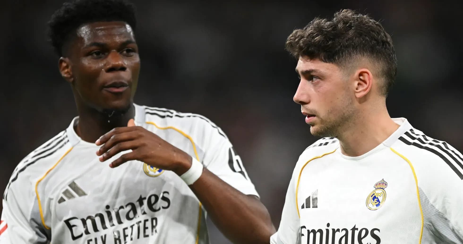 Two Real Madrid players discussing on the pitch Two Real Madrid players discussing on the pitch