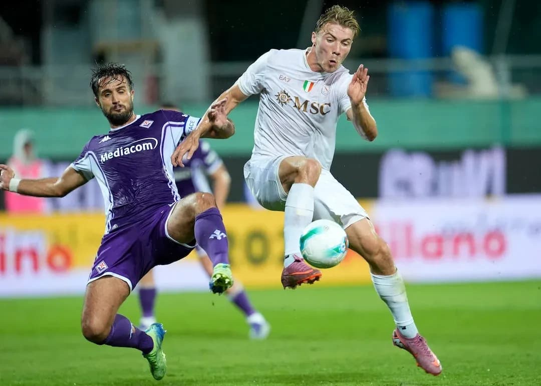Fiorentina player challenges Napoli opponent for ball Fiorentina player challenges Napoli opponent for ball