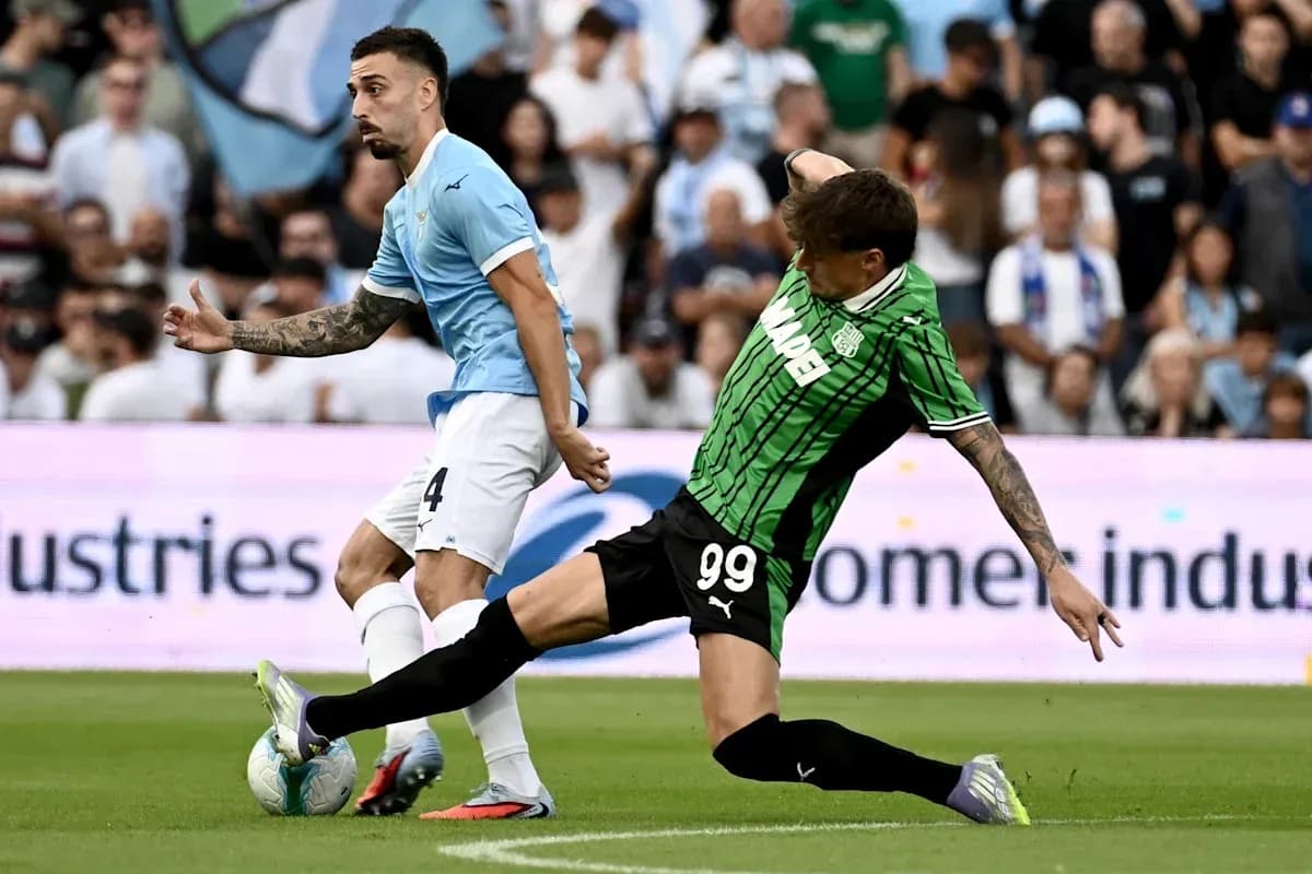 Lazio and Sassuolo players competing for the ball Lazio and Sassuolo players competing for the ball