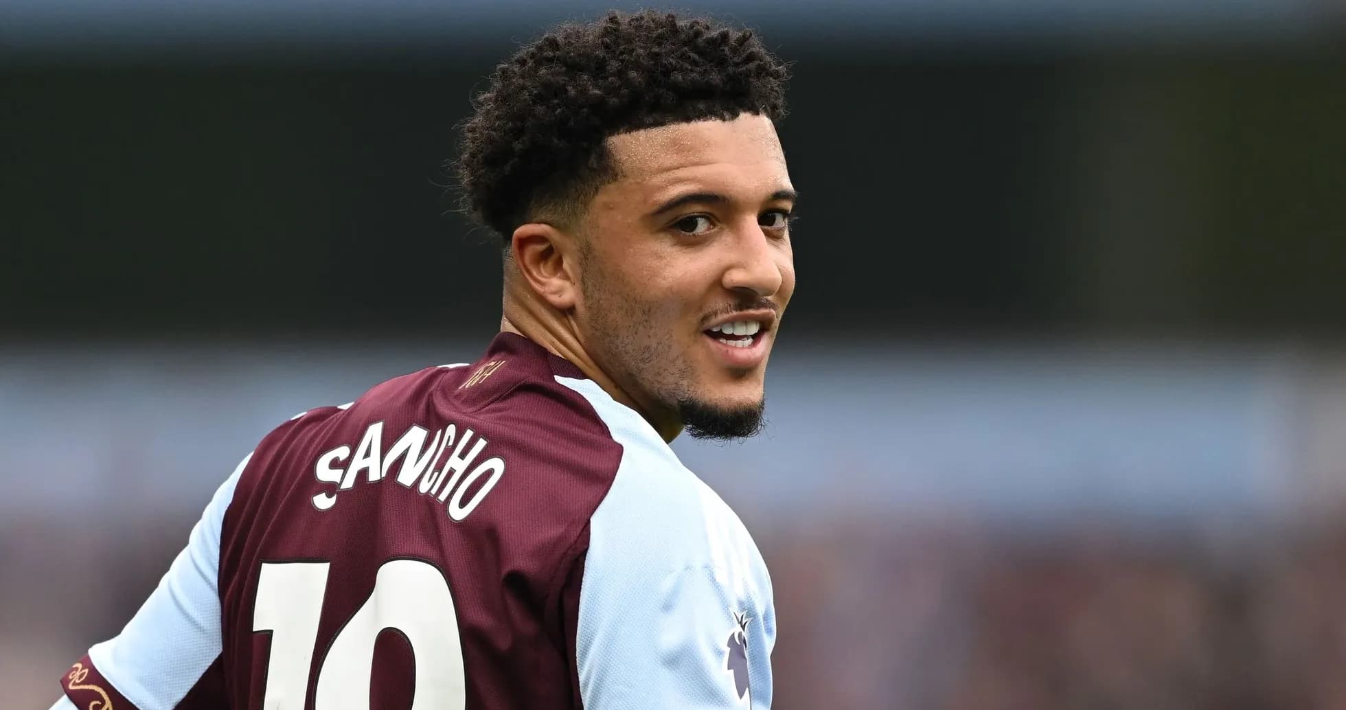 Player wearing jersey number 10, smiling at camera Player wearing jersey number 10, smiling at camera