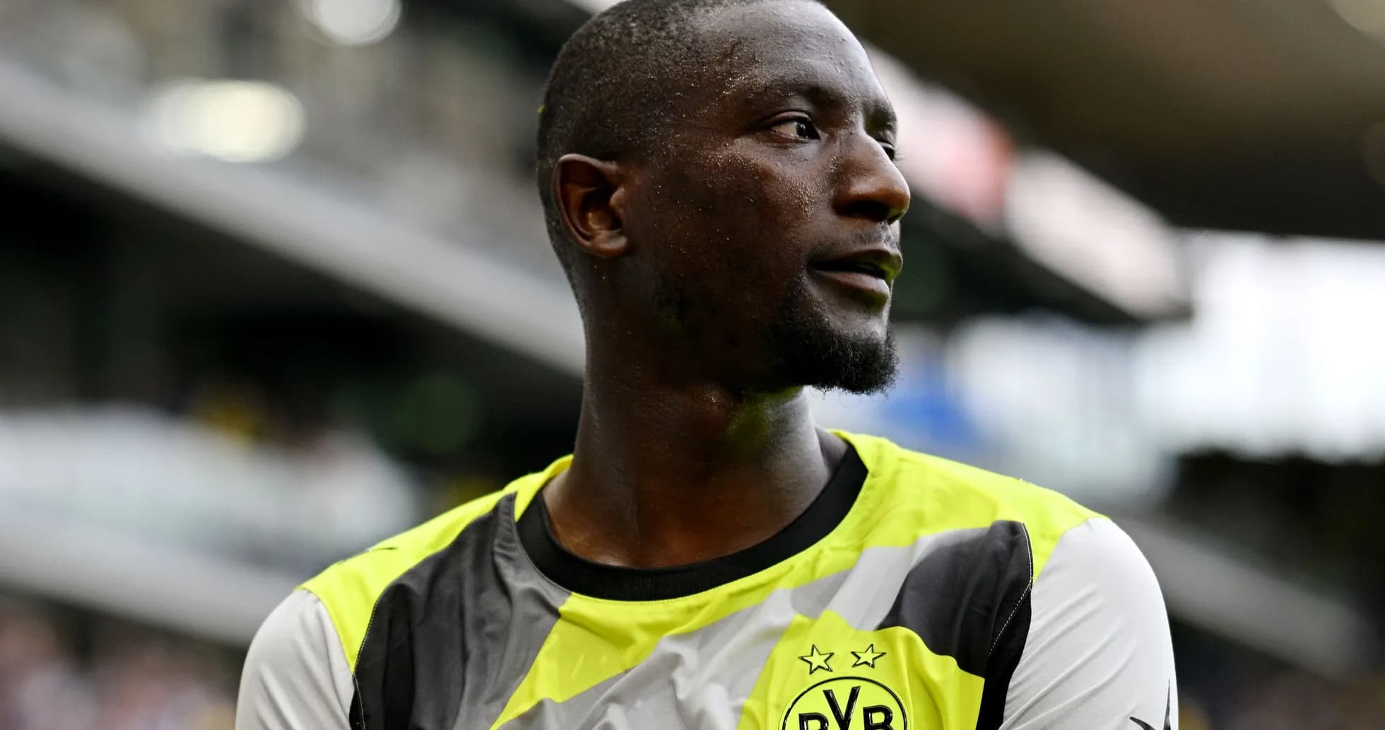 Player in Borussia Dortmund training kit on field Player in Borussia Dortmund training kit on field