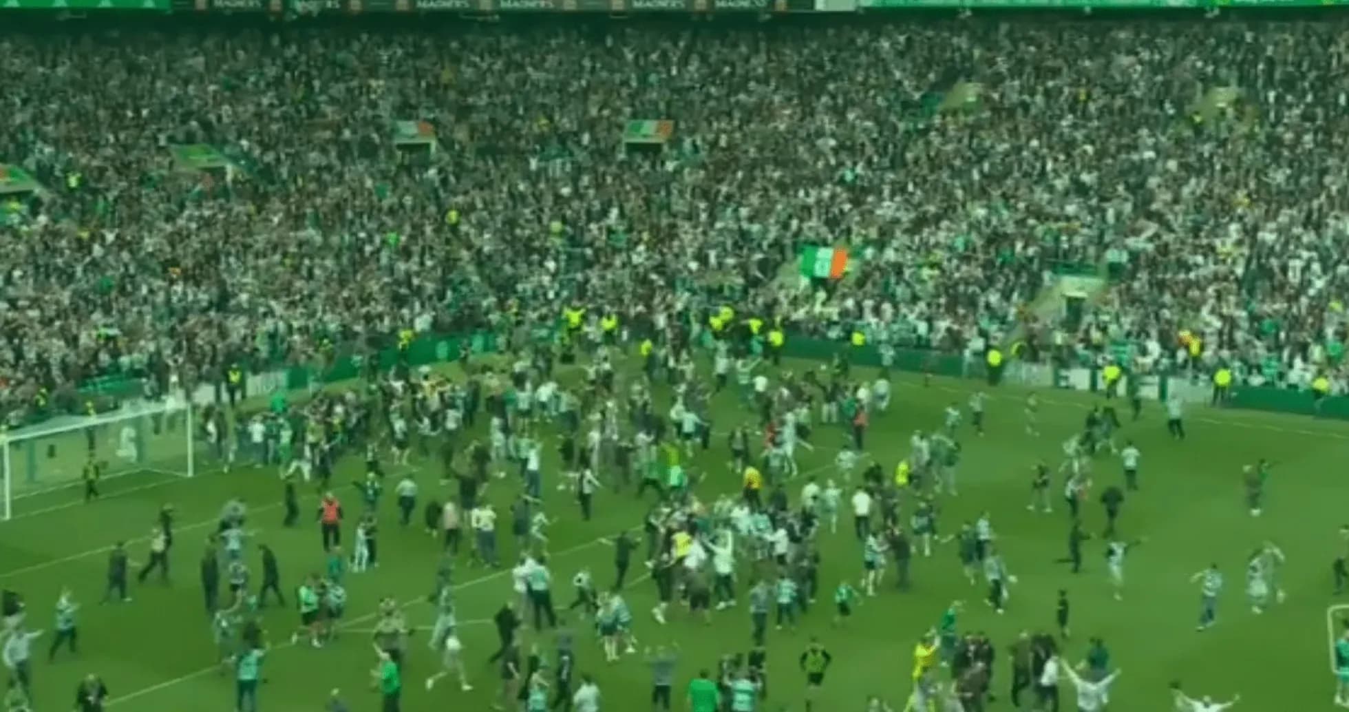 Crowd celebrating on the pitch after match Crowd celebrating on the pitch after match