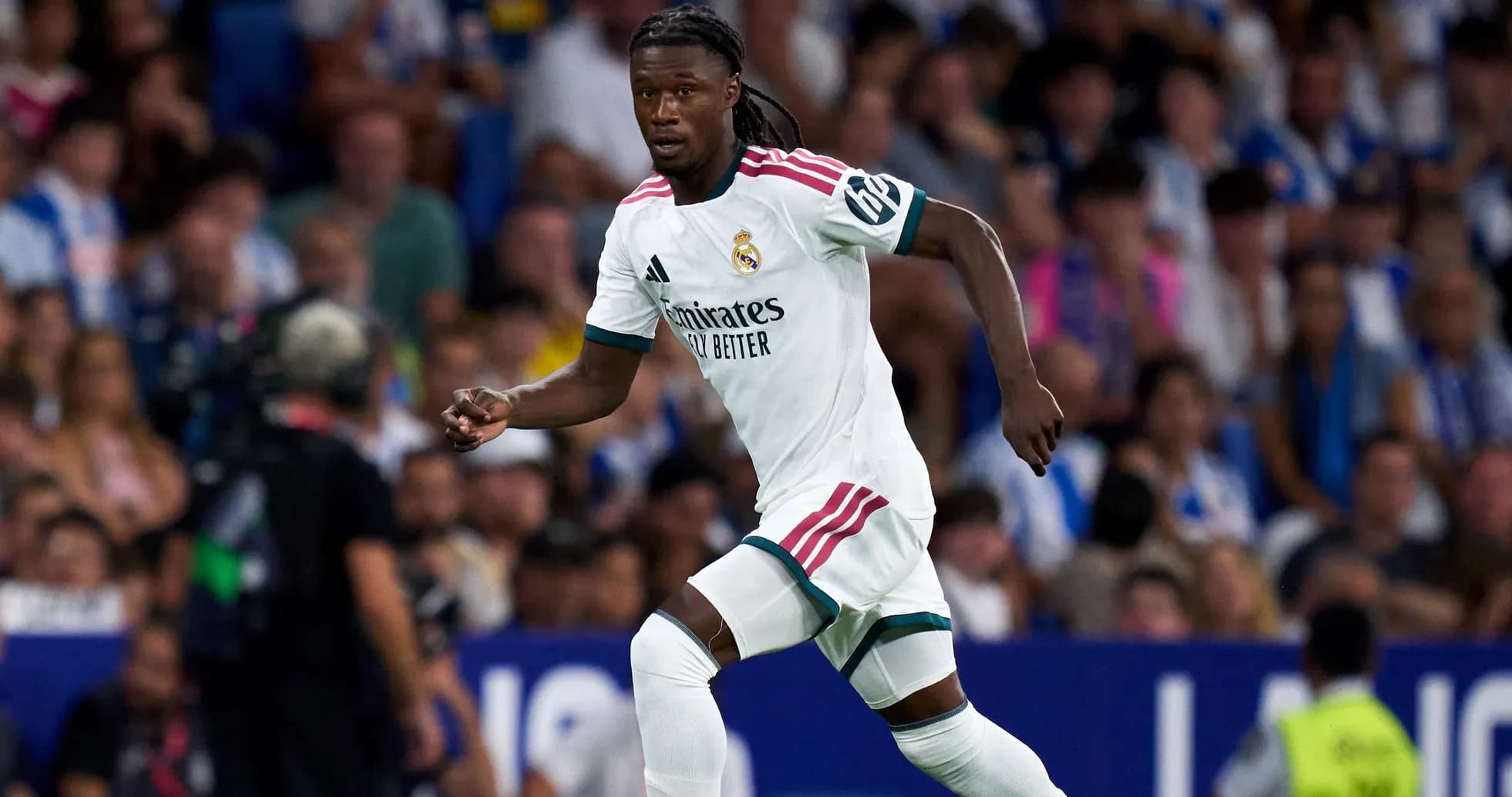 Player in Real Madrid kit running during match Player in Real Madrid kit running during match