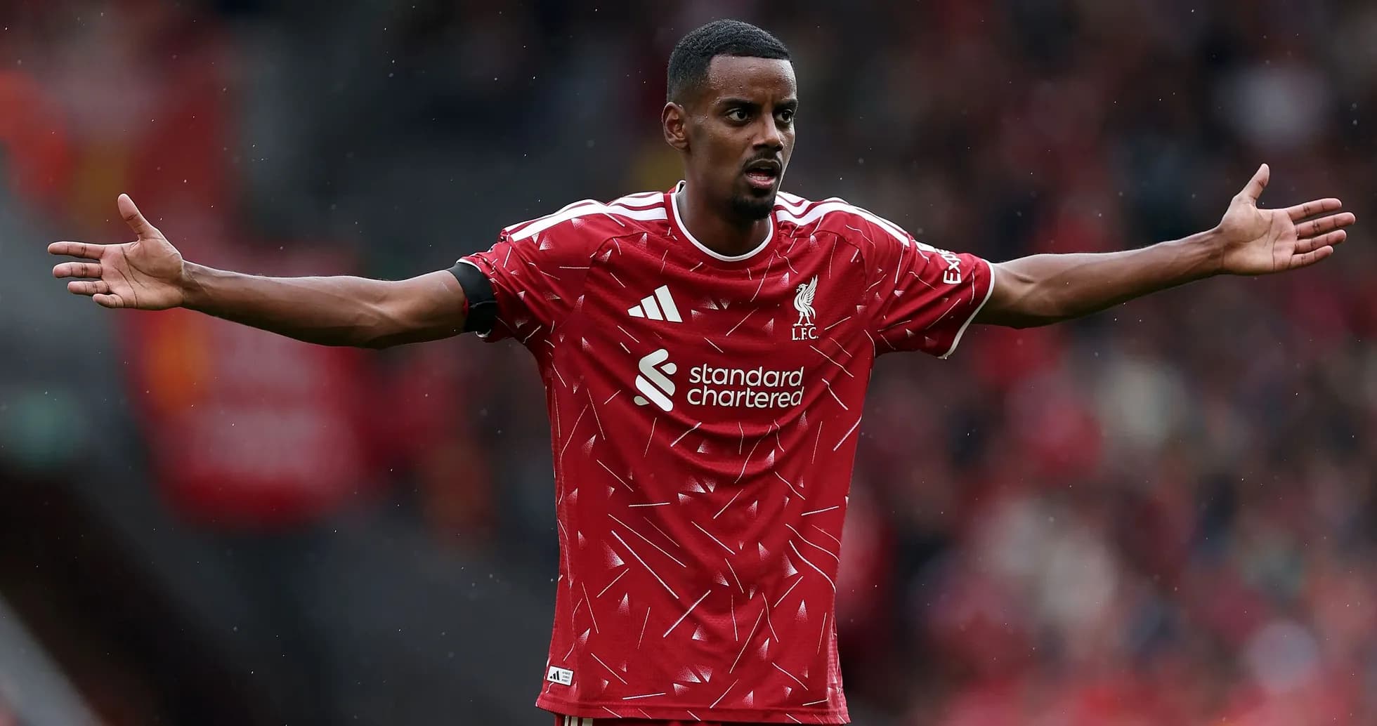 Player gesturing during match in Liverpool kit Player gesturing during match in Liverpool kit