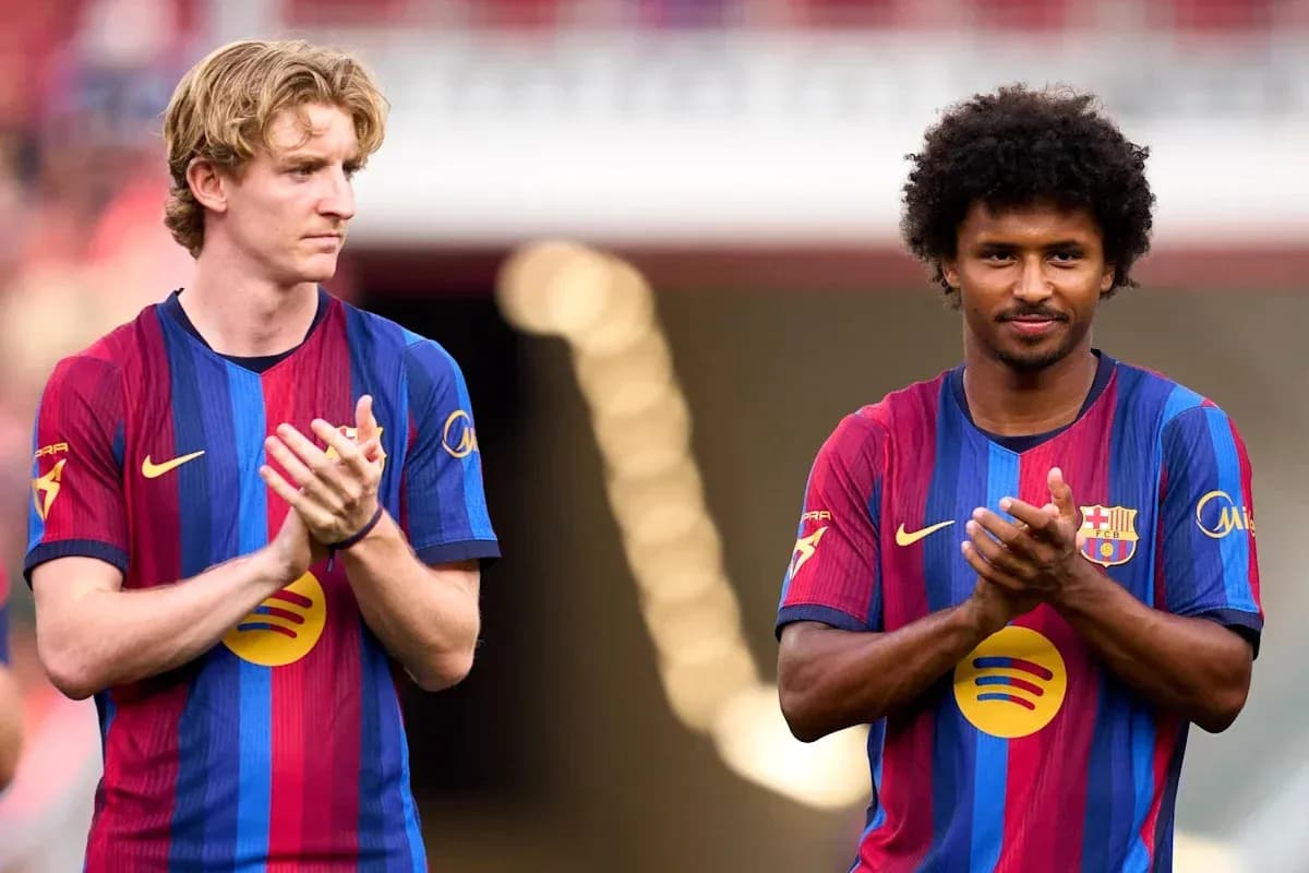 Two FC Barcelona players applauding on the field Two FC Barcelona players applauding on the field