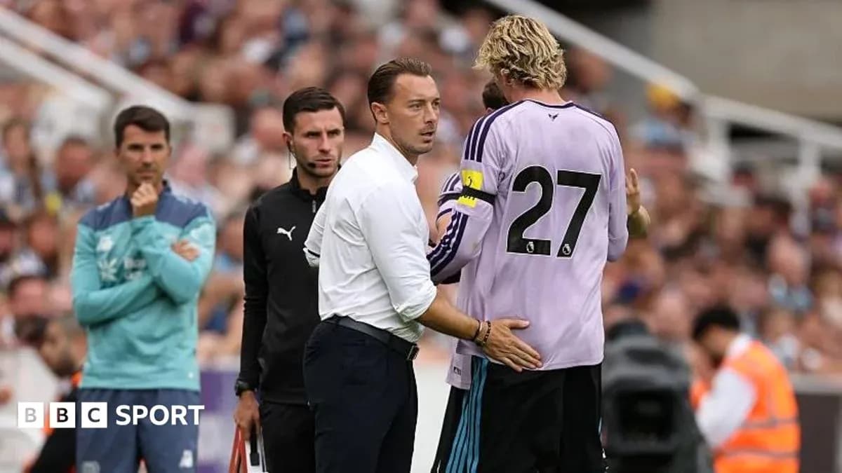 Coach speaking to goalkeeper during match substitution Coach speaking to goalkeeper during match substitution