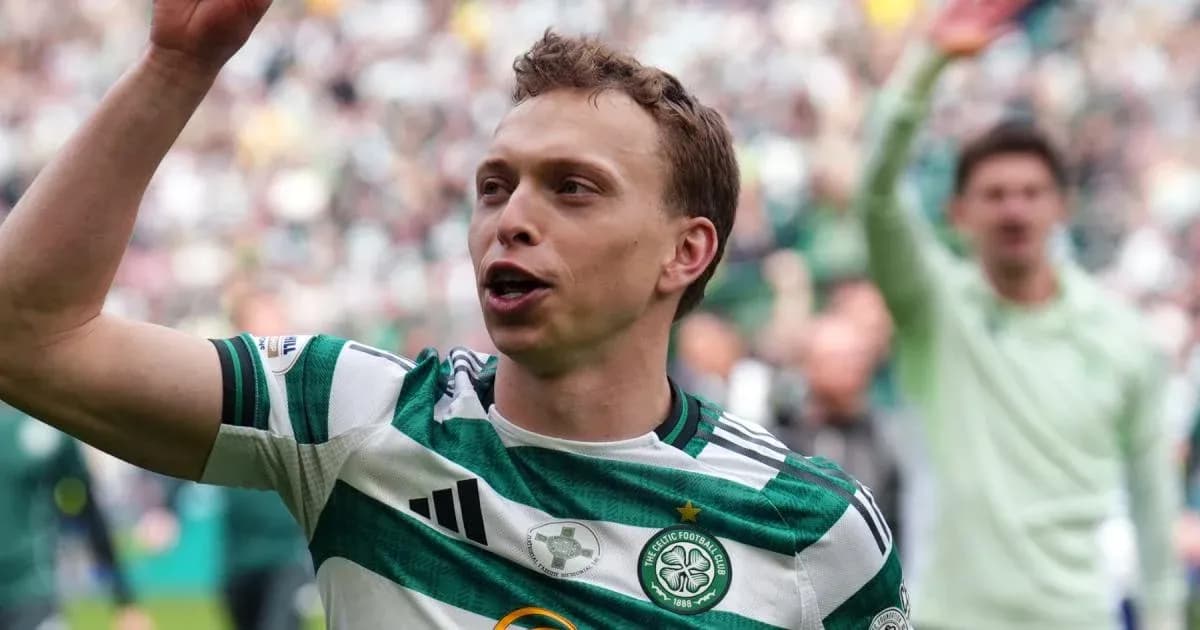 Celtic player celebrating with fans during match Celtic player celebrating with fans during match