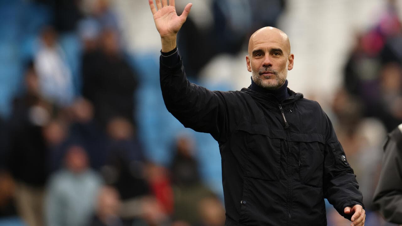 Manager waving to fans during match day Manager waving to fans during match day