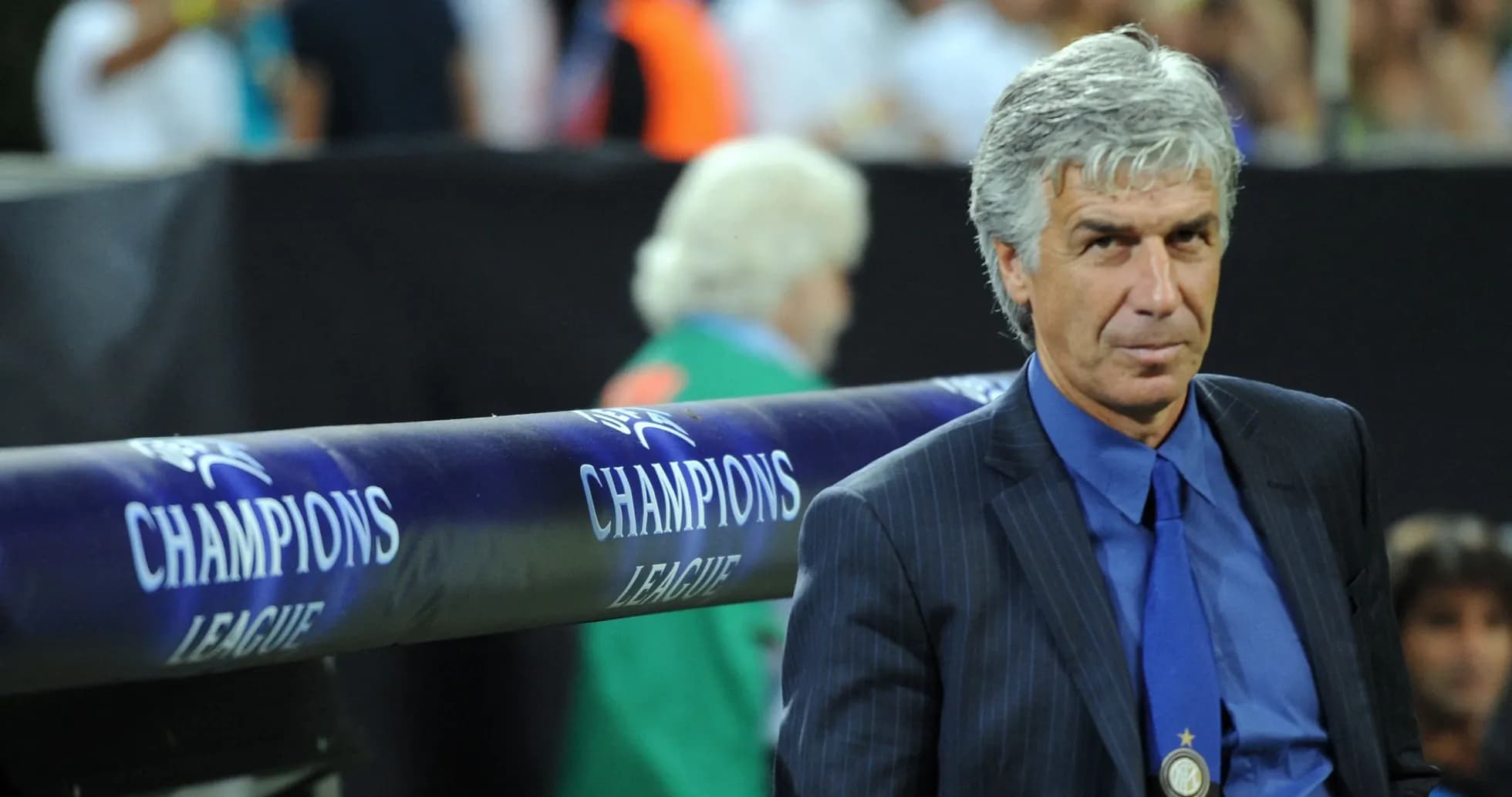Coach seated near Champions League branding during match Coach seated near Champions League branding during match