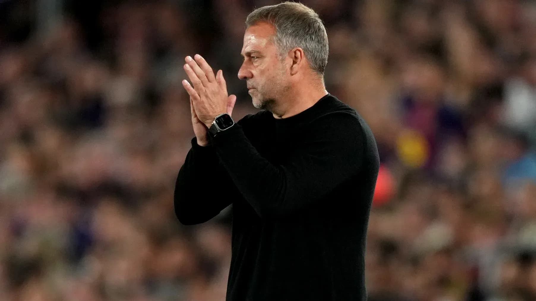 Coach applauding during match at stadium Coach applauding during match at stadium