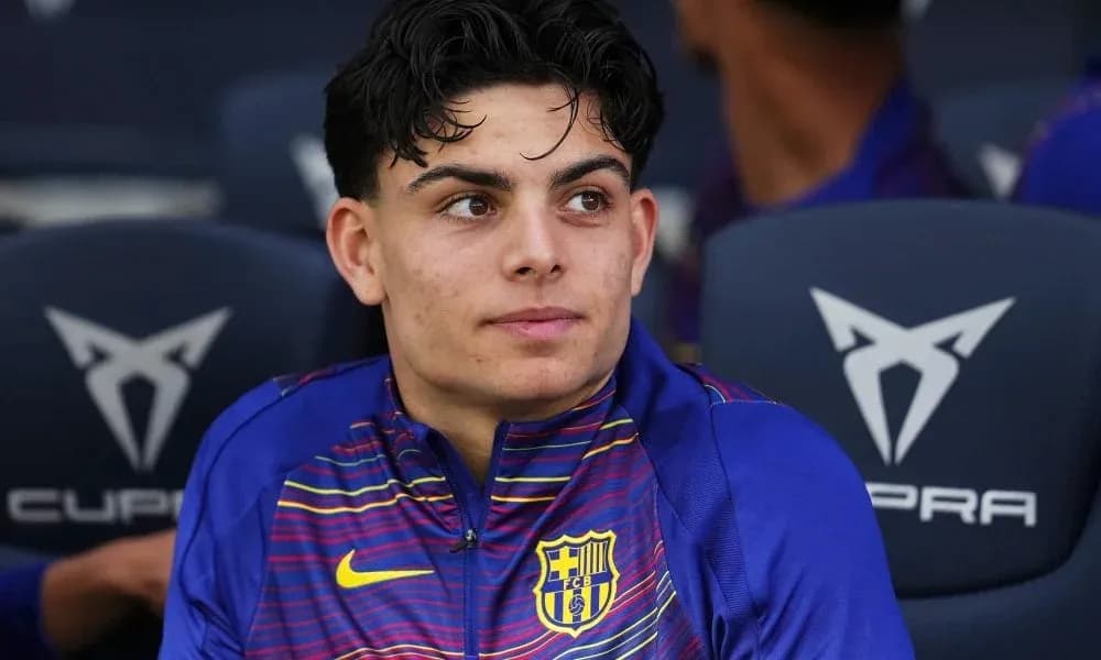Young player seated on bench during match Young player seated on bench during match