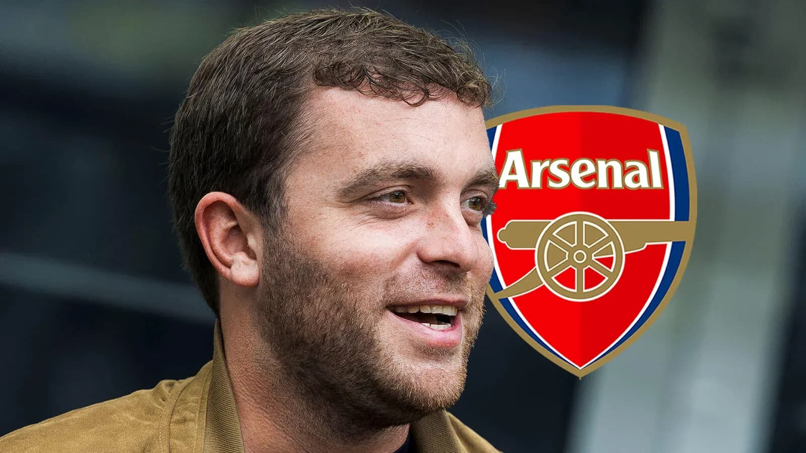 Person smiling with Arsenal logo in background Person smiling with Arsenal logo in background