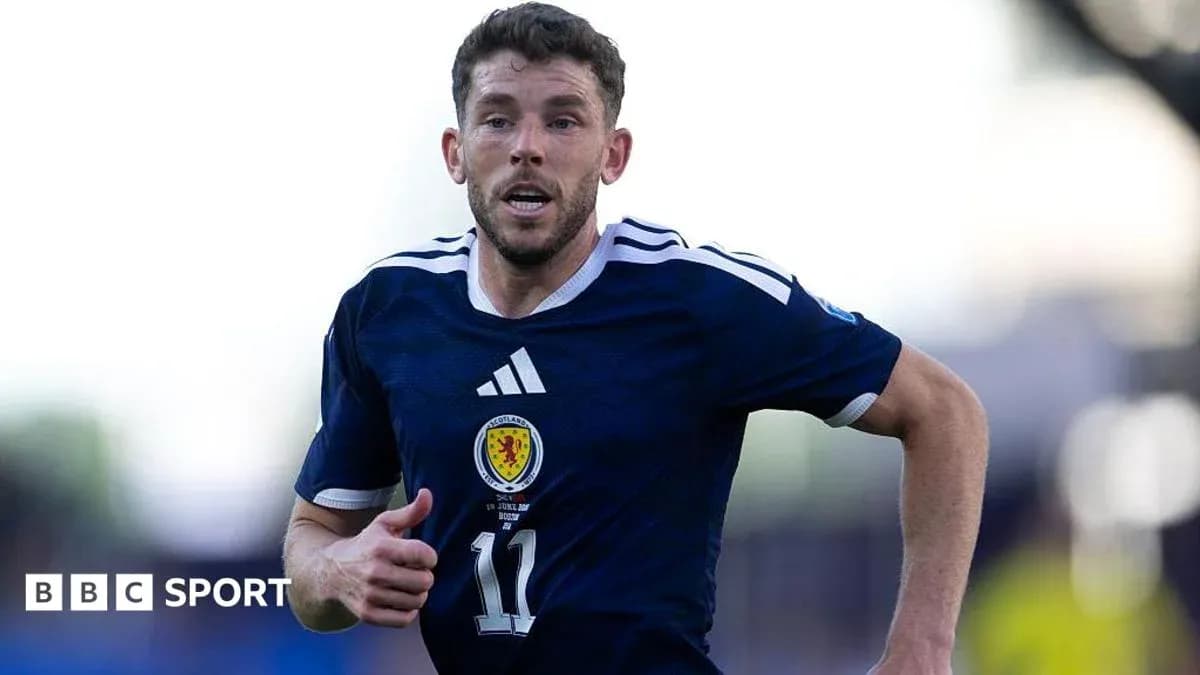 Player running in Scotland national team jersey Player running in Scotland national team jersey