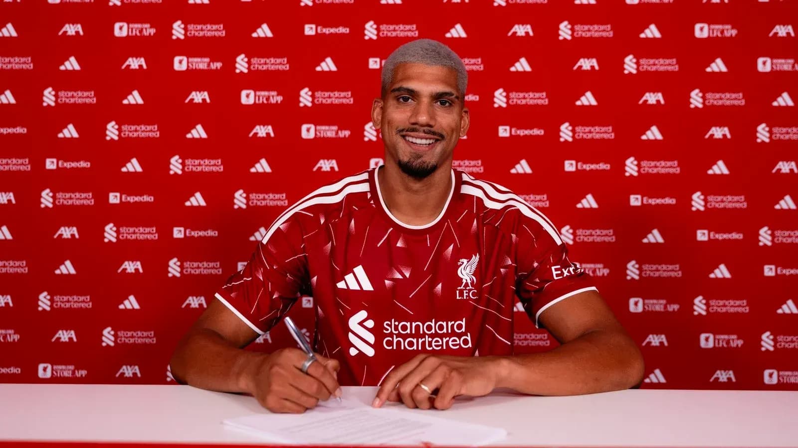 Player signing contract at Liverpool FC announcement Player signing contract at Liverpool FC announcement