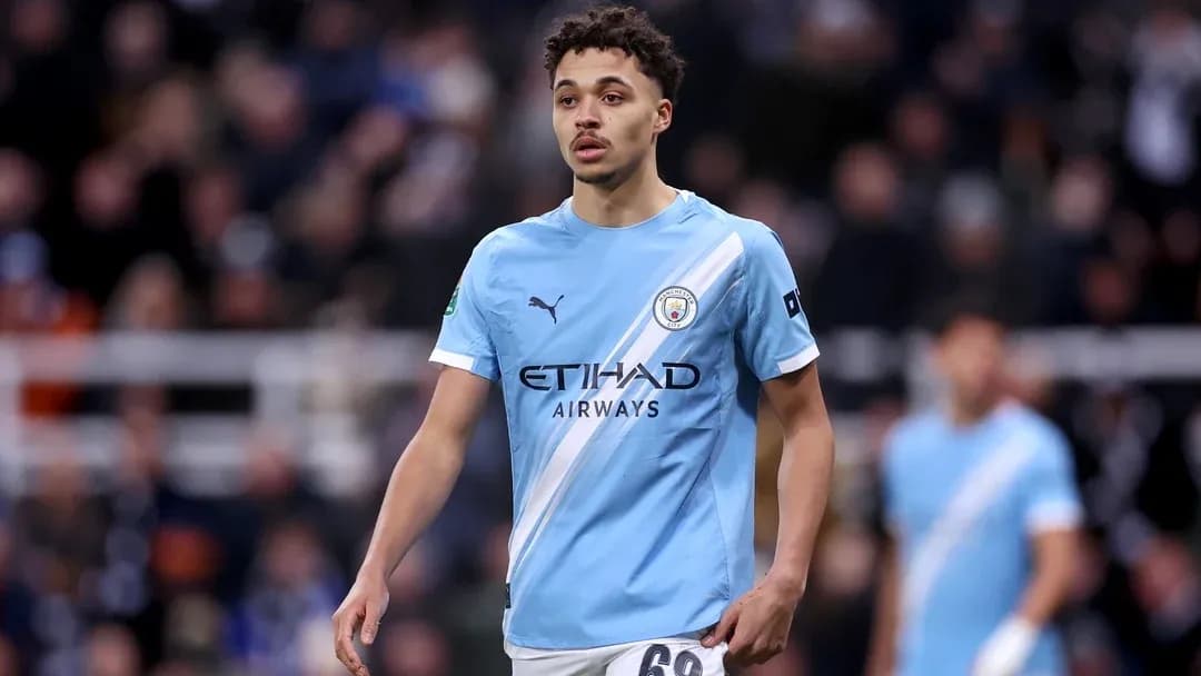 Player wearing Manchester City kit on the field Player wearing Manchester City kit on the field