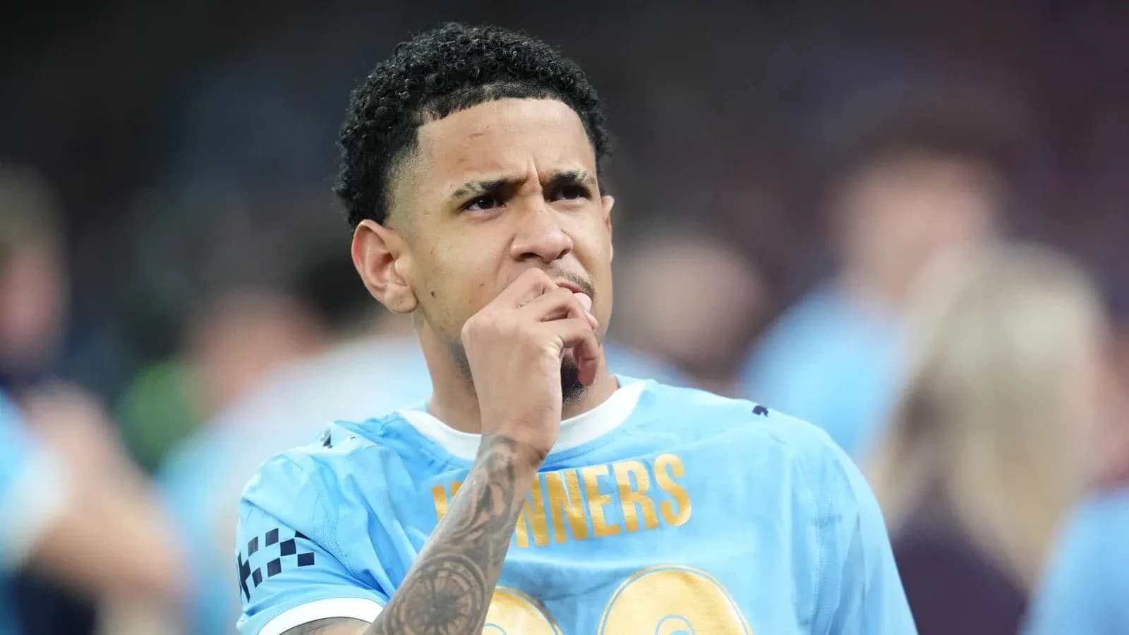 Player in blue jersey pondering during match Player in blue jersey pondering during match