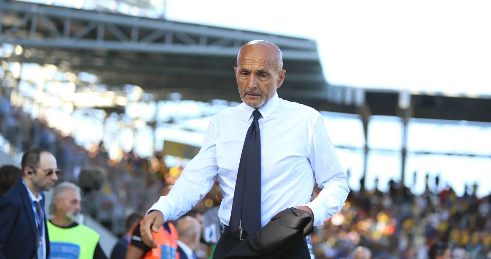 Coach walking on the sideline during a match Coach walking on the sideline during a match