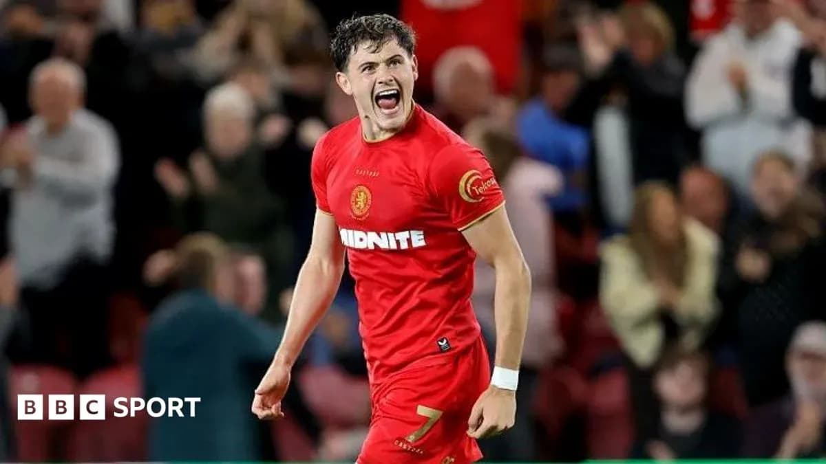 Player celebrating enthusiastically after scoring a goal Player celebrating enthusiastically after scoring a goal