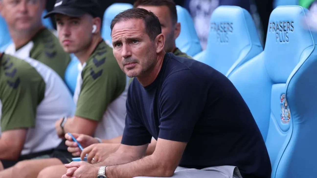 Manager sitting on bench during match Manager sitting on bench during match