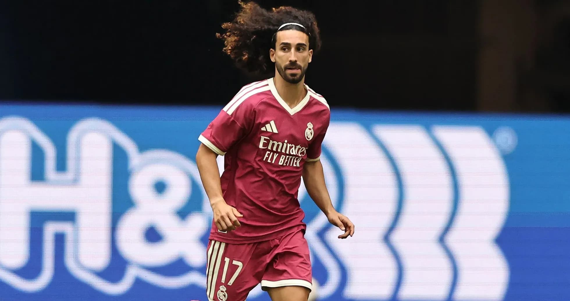 Player in pink jersey running on the field Player in pink jersey running on the field