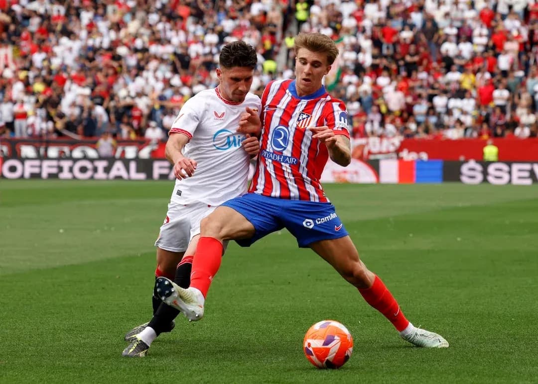 Sevilla and Atletico Madrid players contesting the ball Sevilla and Atletico Madrid players contesting the ball
