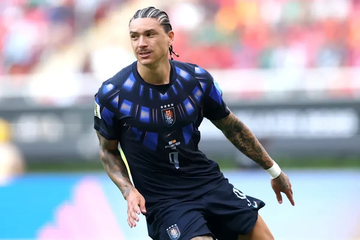 Player in blue jersey running on the field Player in blue jersey running on the field