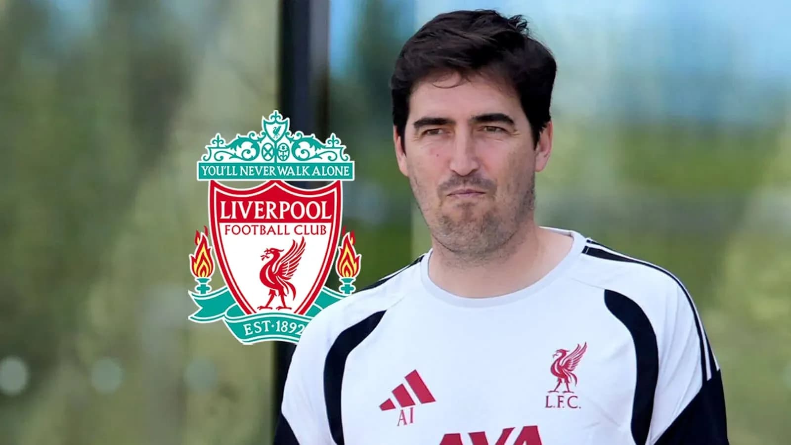 Coaching staff member at Liverpool FC training session Coaching staff member at Liverpool FC training session