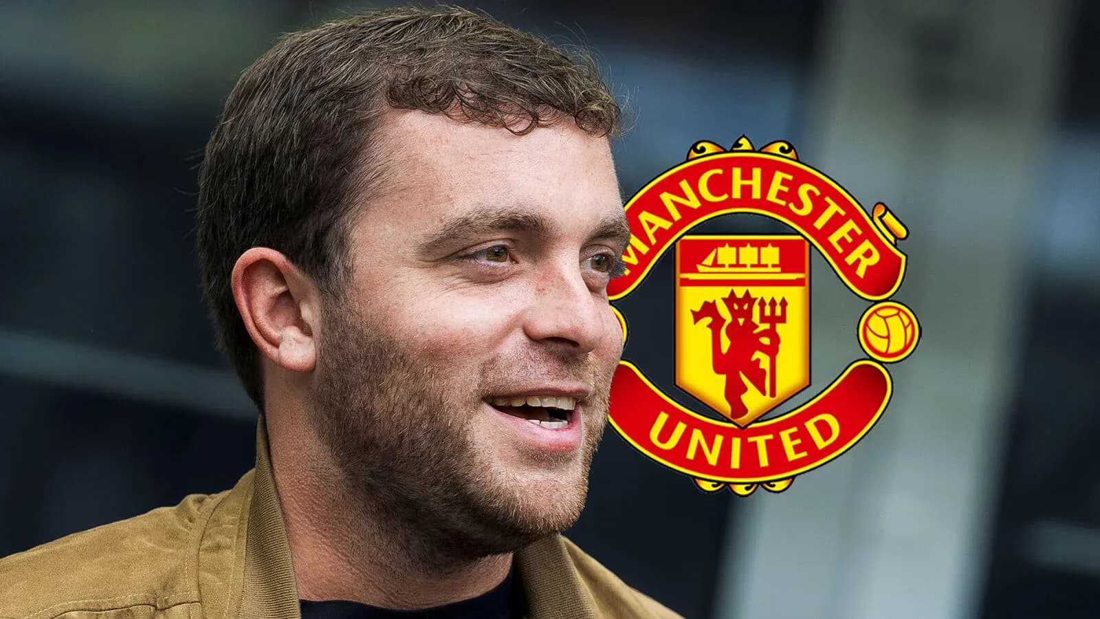Man smiling with Manchester United logo in background Man smiling with Manchester United logo in background