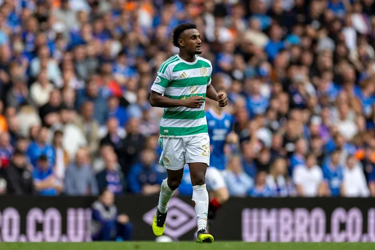 Player in Celtic kit running on the pitch Player in Celtic kit running on the pitch