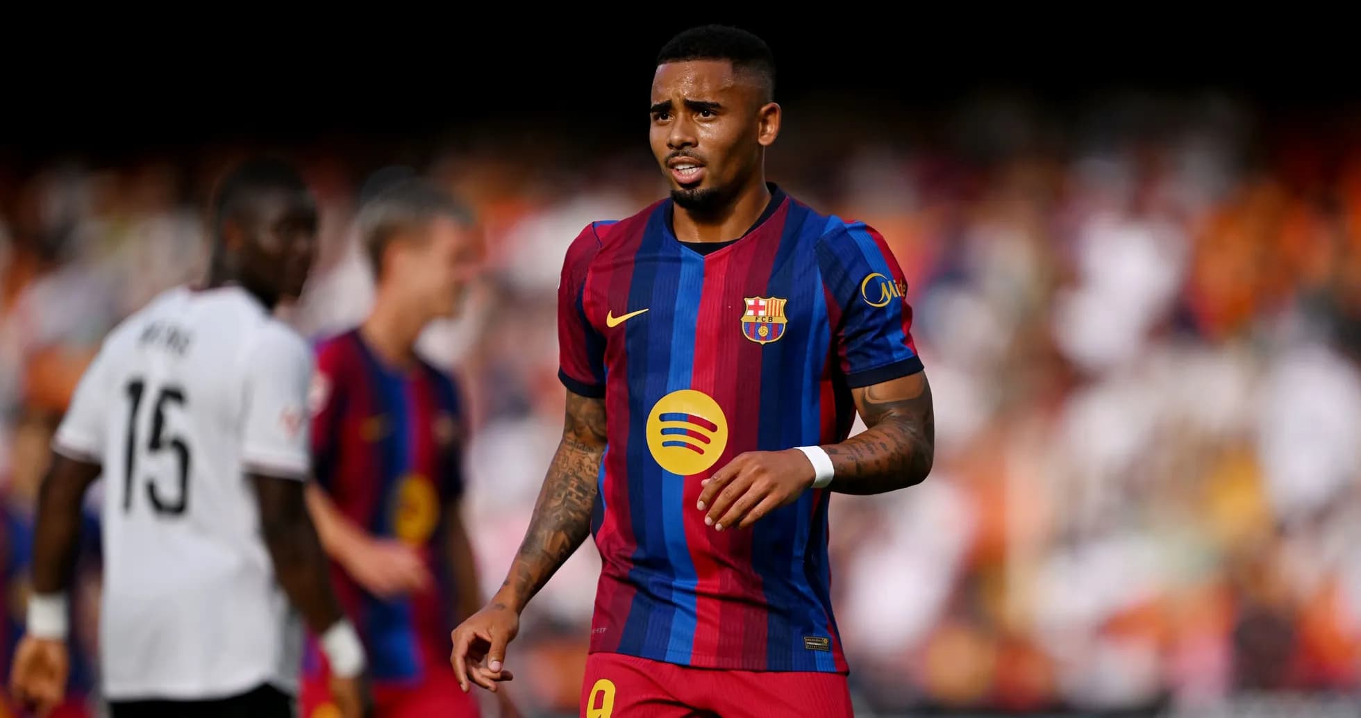 Barcelona player walking on pitch during match Barcelona player walking on pitch during match