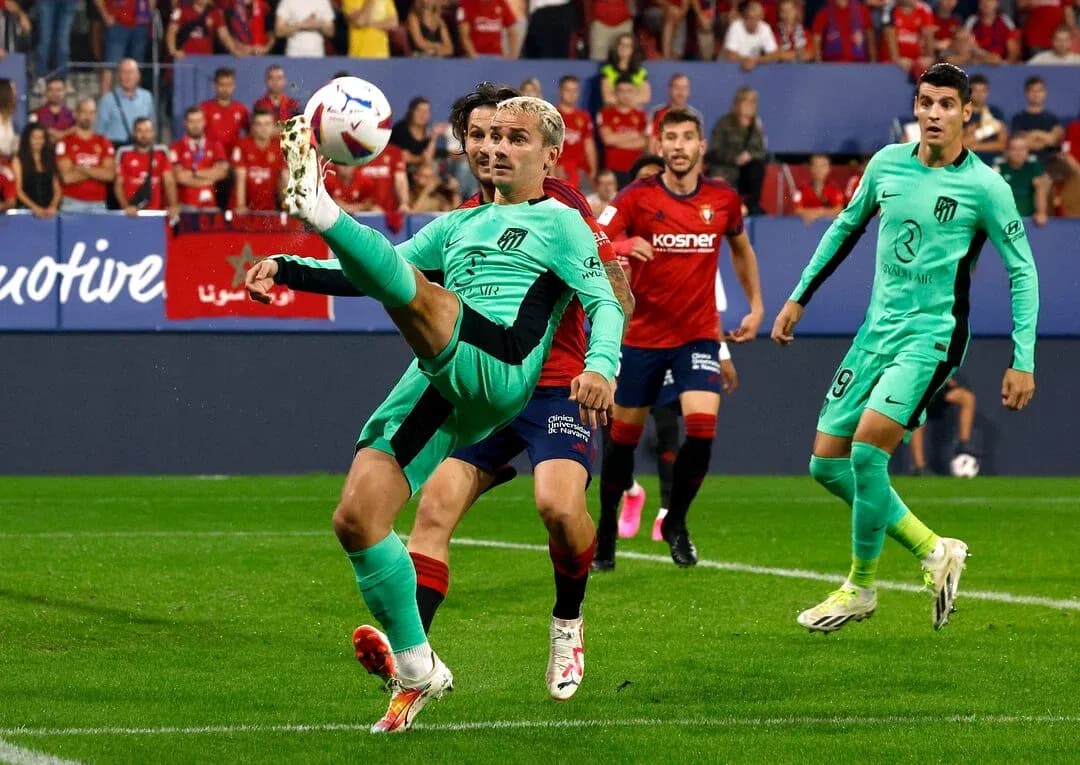 Antoine Griezmann performing a kick during match Antoine Griezmann performing a kick during match
