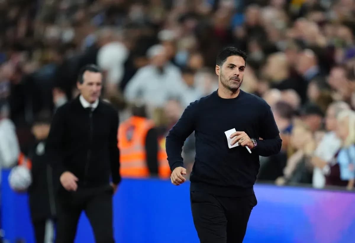 Two football managers walking on the sideline Two football managers walking on the sideline