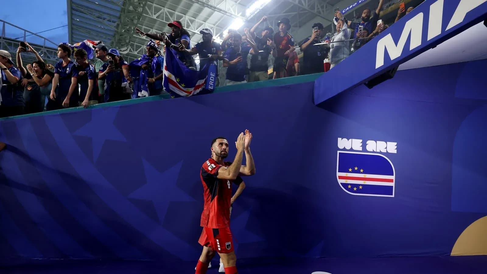 Player applauding fans after the match in stadium Player applauding fans after the match in stadium