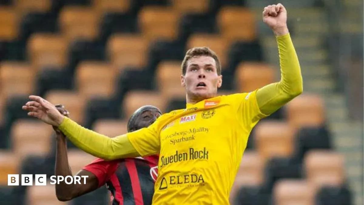 Player jumping for the ball during a match Player jumping for the ball during a match