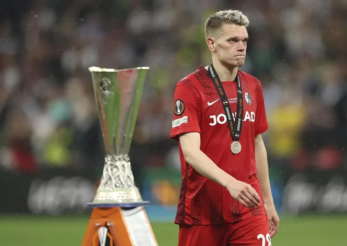 Player walking past UEFA Europa League trophy Player walking past UEFA Europa League trophy