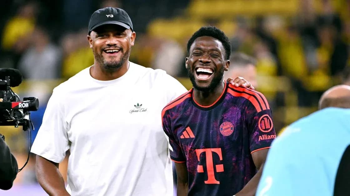 Two men laughing on the football pitch Two men laughing on the football pitch