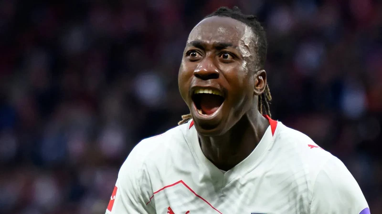 Player celebrating a goal with excitement Player celebrating a goal with excitement